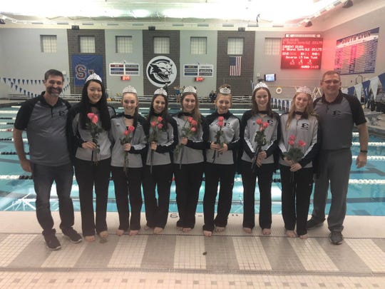 South Lyon East diving coach Kevin Ferguson, Hannah Sun, Alyssa Mayer, Melanie Cosens, Lindsay Boals, Sophia Ohland, Lindsey Filhart, Allison Engberg and swim coach John Burch celebrate senior night. Photo by Jill Ohland.